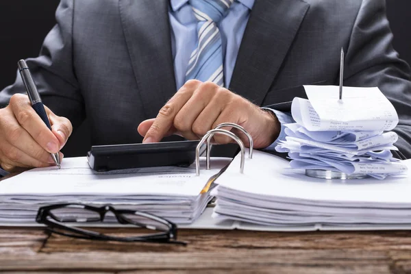 Businessman Calculating Invoice — Stock Photo, Image