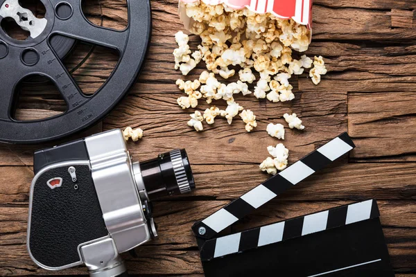 Camera With Film ClapperBoard And Popcorn
