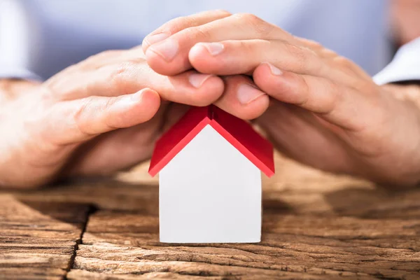 Hands Over House Model — Stock Photo, Image