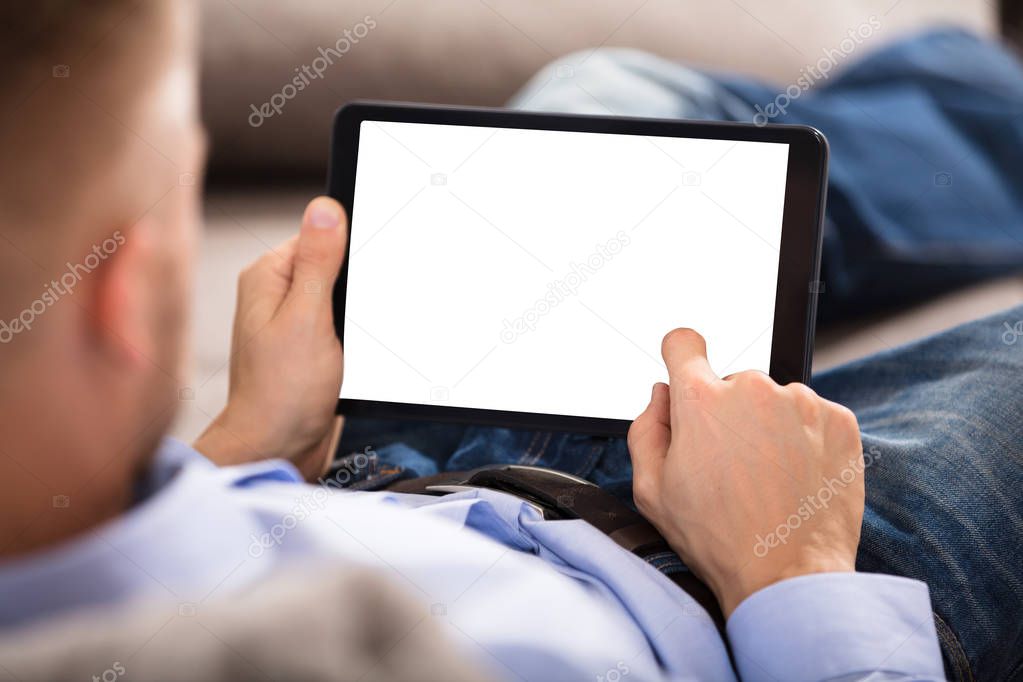Man Holding Digital Tablet