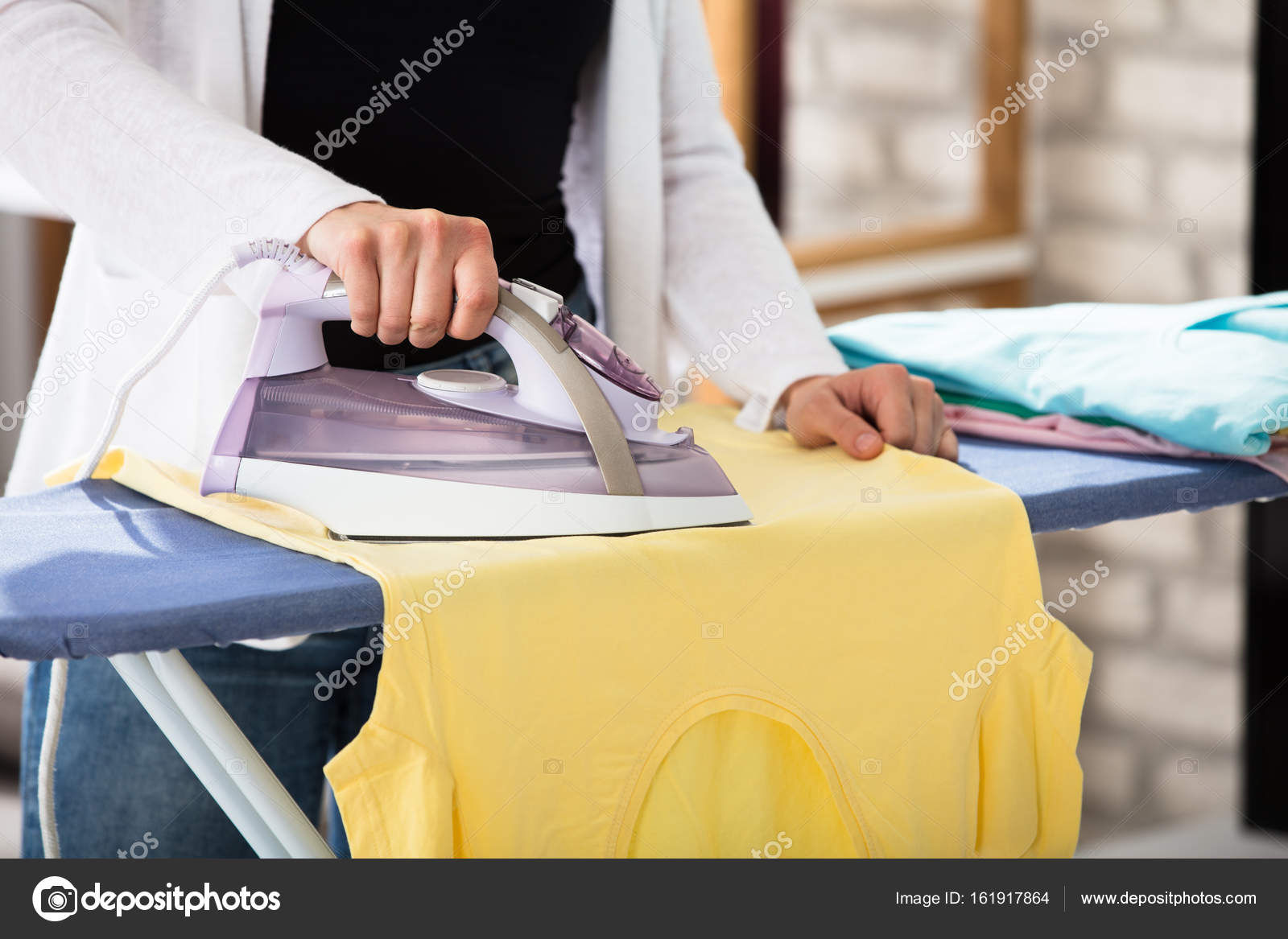 Woman Ironing Tshirt Stock Photo by ©AndreyPopov 161917864