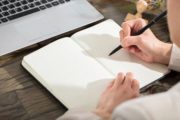 Business Person Writing In Notebook — Stock Photo, Image