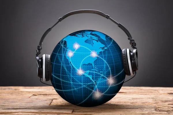 Headphones On Blue Globe — Stock Photo, Image