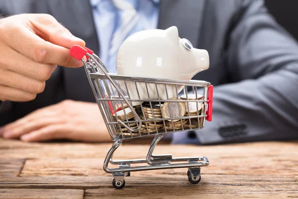 Businessman Pushing Piggybank — Stock Photo, Image