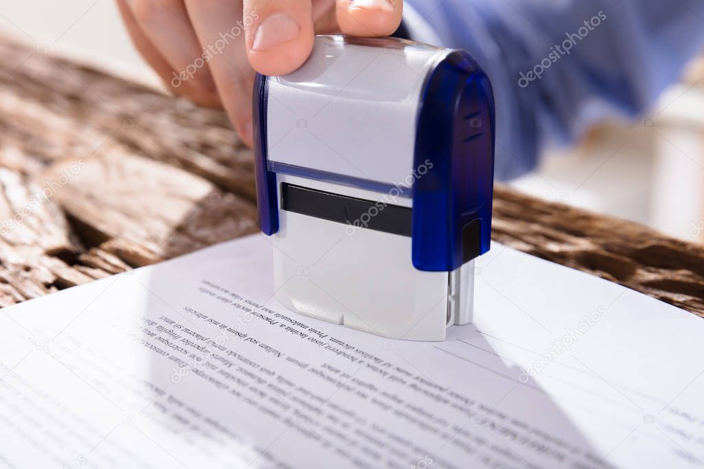 Person Stamping Document