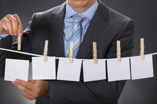 Businessman Pinning Blank Paper — Stock Photo, Image