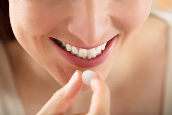 Female Putting White Pill — Stock Photo, Image