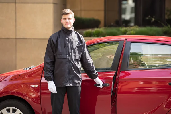 Young Male Valet Opening Car — Stock Photo, Image