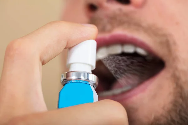 Man Spraying Breath Freshener — Stock Photo, Image