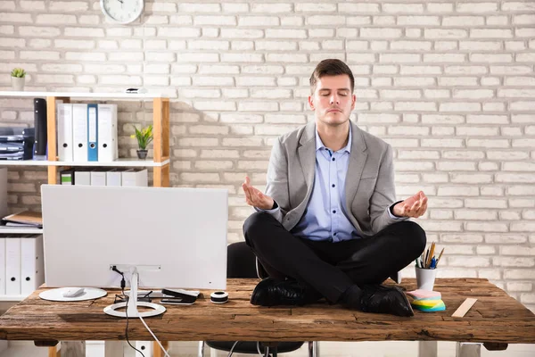 Businessman Meditating In Office — Stock Photo, Image