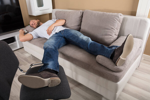 Man Sleeping On Couch