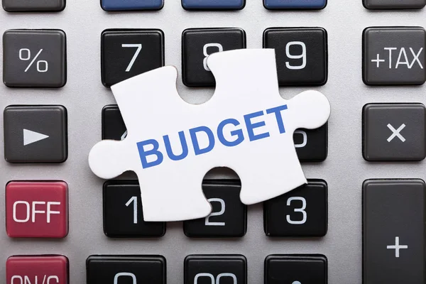 Jigsaw Puzzle Piece With Budget — Stock Photo, Image