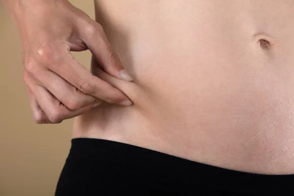 Woman Checking Tummy Fat — Stock Photo, Image