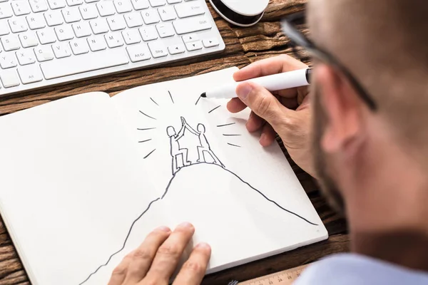 Businessman Drawing Figures — Stock Photo, Image