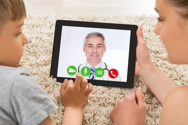 Mother Son Video Conferencing Male Doctor Tablet Computer — Stock Photo, Image