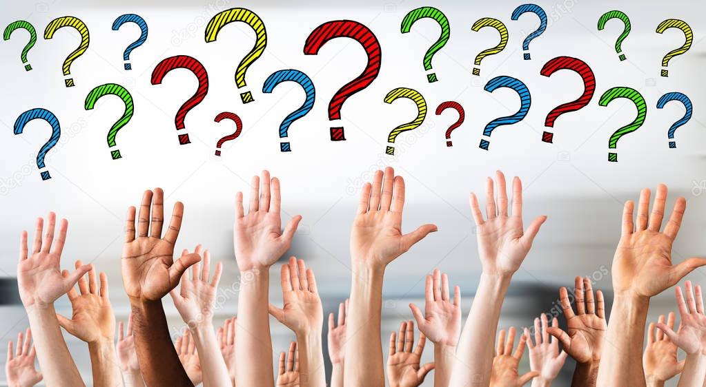 Digital composite image of multicolored question marks above business people's hands