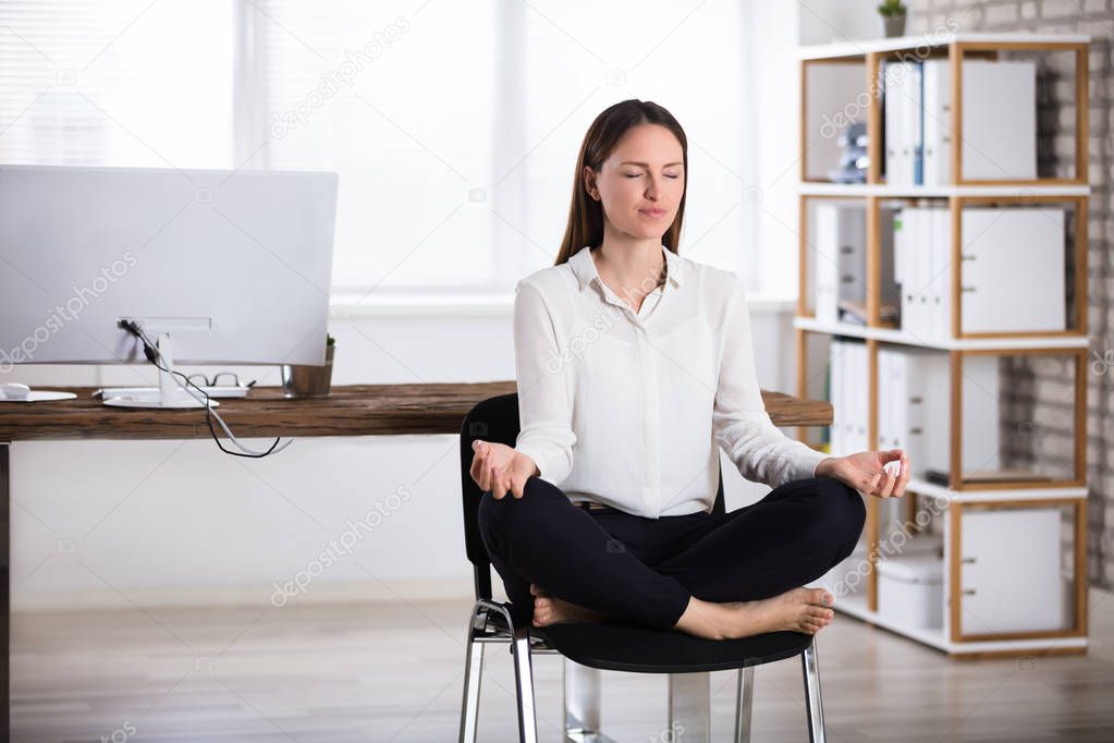 Businesswoman Doing Meditation