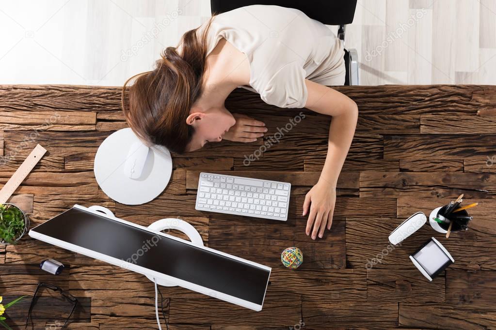 Businesswoman Sleeping In Office