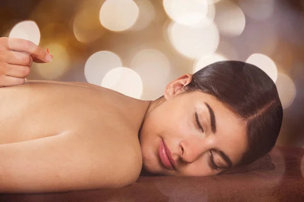 Woman Receiving Acupuncture Treatment