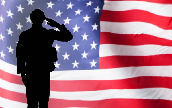 Solider Saluting Against Flag — Stock Photo, Image