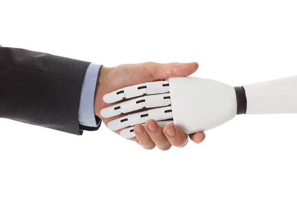 Empresario sacudiendo las manos con robot — Foto de Stock
