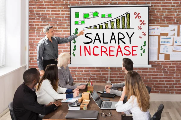 Man Giving Salary Increase Presentation Colleagues — Stock Photo, Image