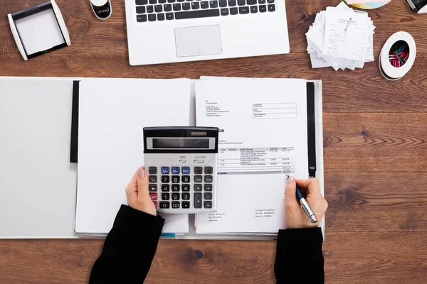 Businessperson Calculating Bill In Office — Stock Photo, Image