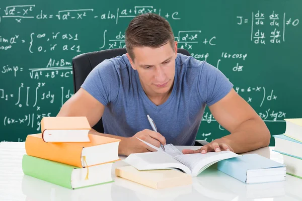 Student Studying In Front Of Blackboard — Stock Photo, Image