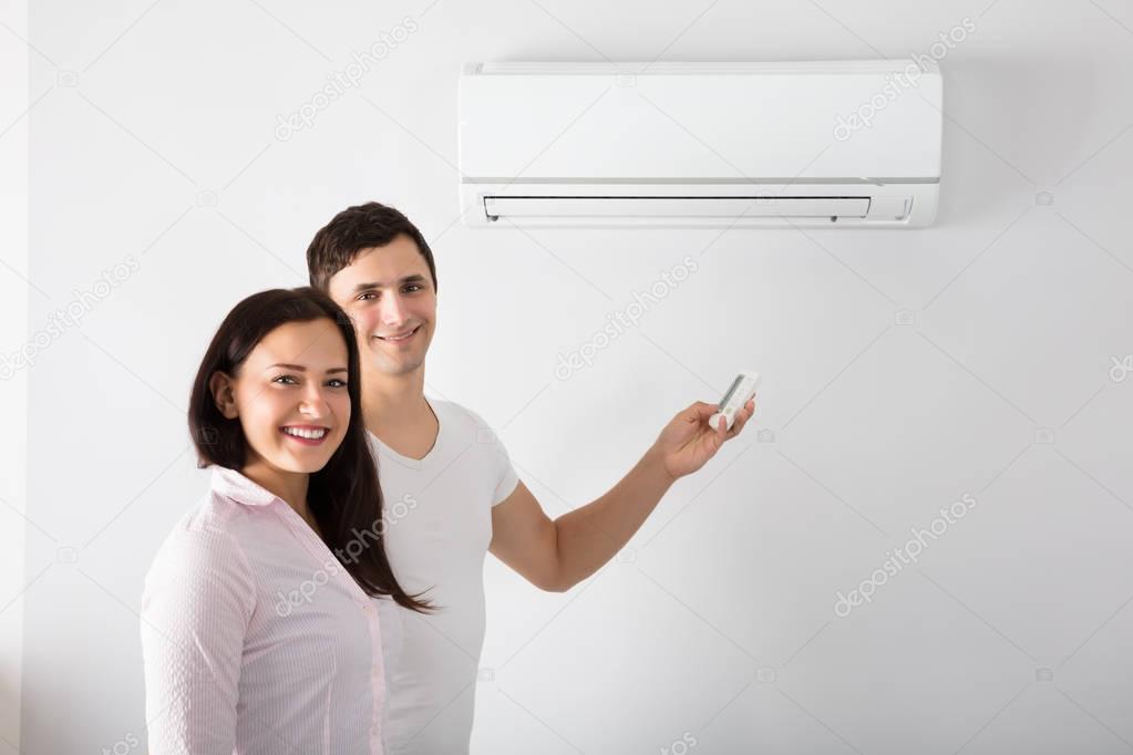 Couple Adjusting Temperature 