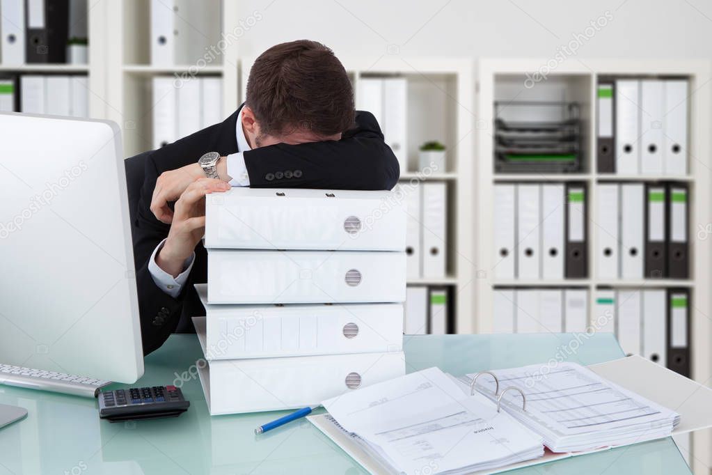 Businessman Sleeping In Office