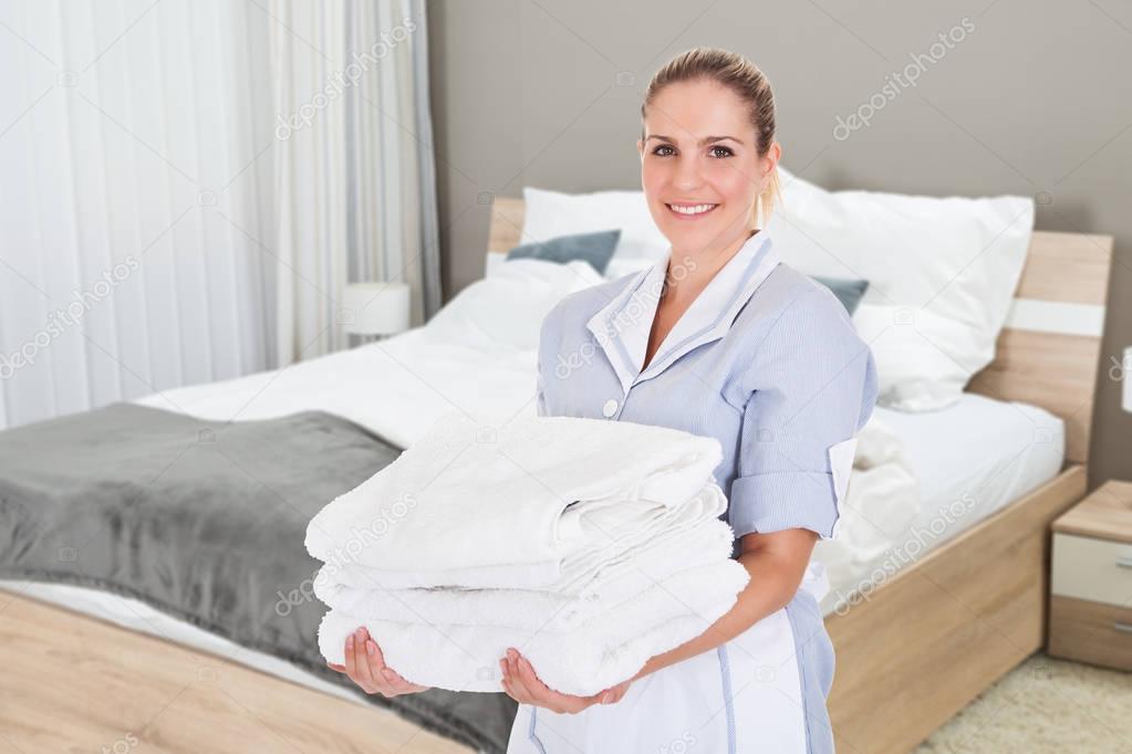 Hotel Maid Holding Towels