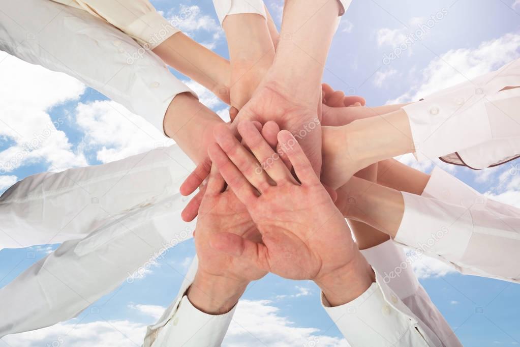 Multiracial Staff Stacking Hands