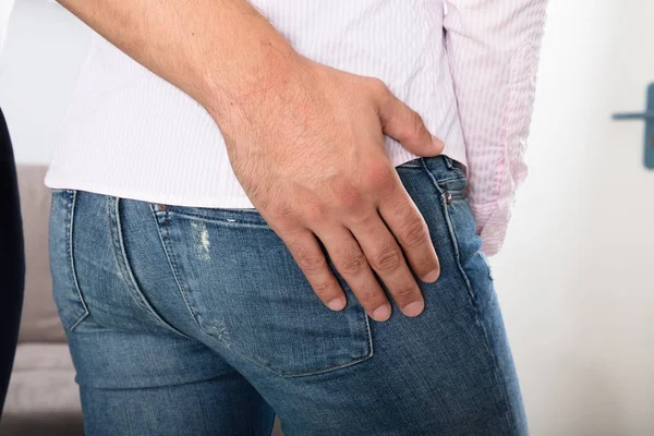 Man Touching Woman 's Buttock — стоковое фото