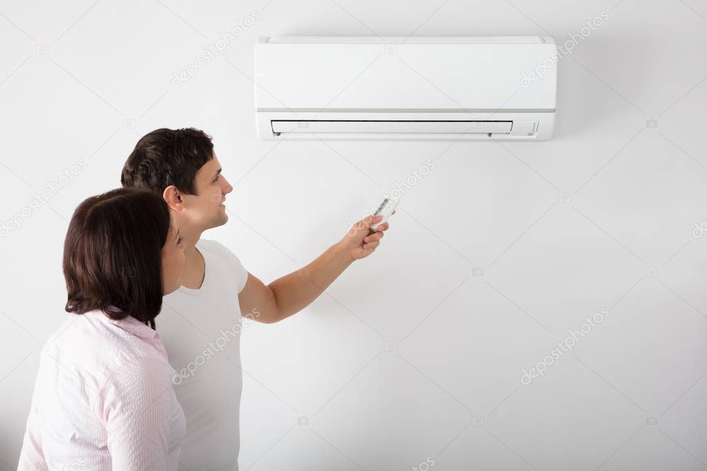 Couple Adjusting Temperature 