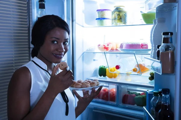 Woman Eating Cookie