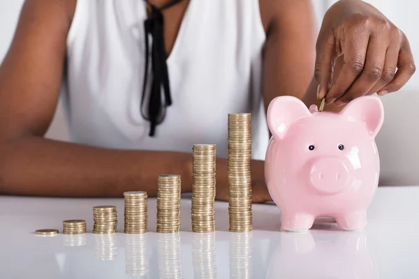 Human Putting Coin In Piggybank — Stock Photo, Image