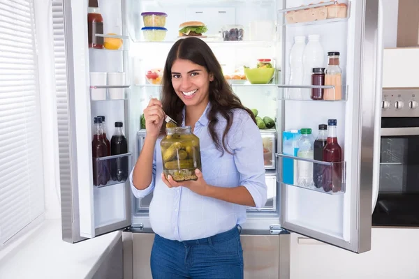 Young Woman Eating Pickle — Stock Photo, Image