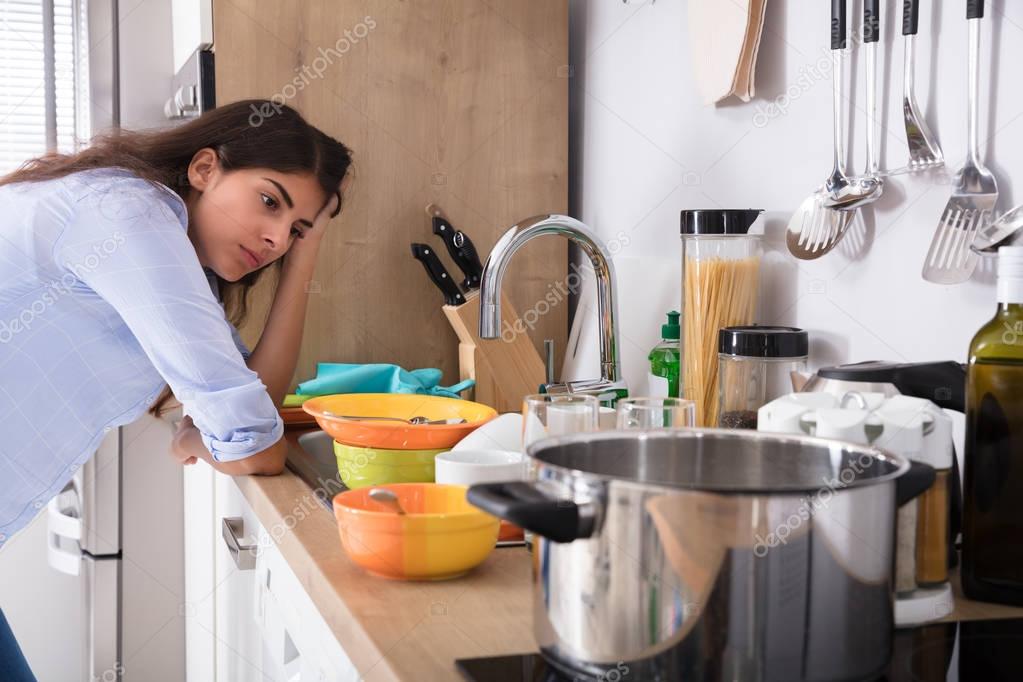 Woman Standing Near Kitchen Sink 