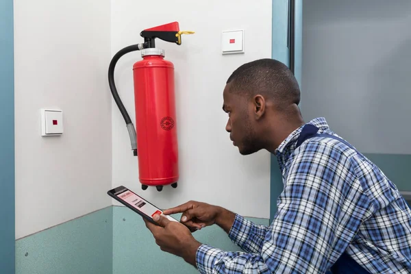 Professional Checking Fire Extinguisher — Stock Photo, Image
