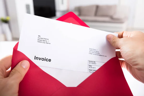 Person Holding Invoice In Envelope — Stock Photo, Image