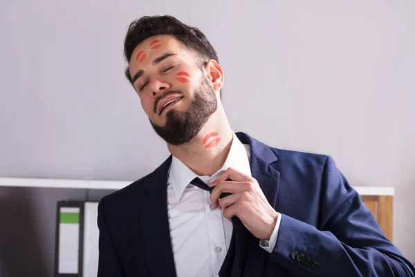 Businessman With Lipstick On Face