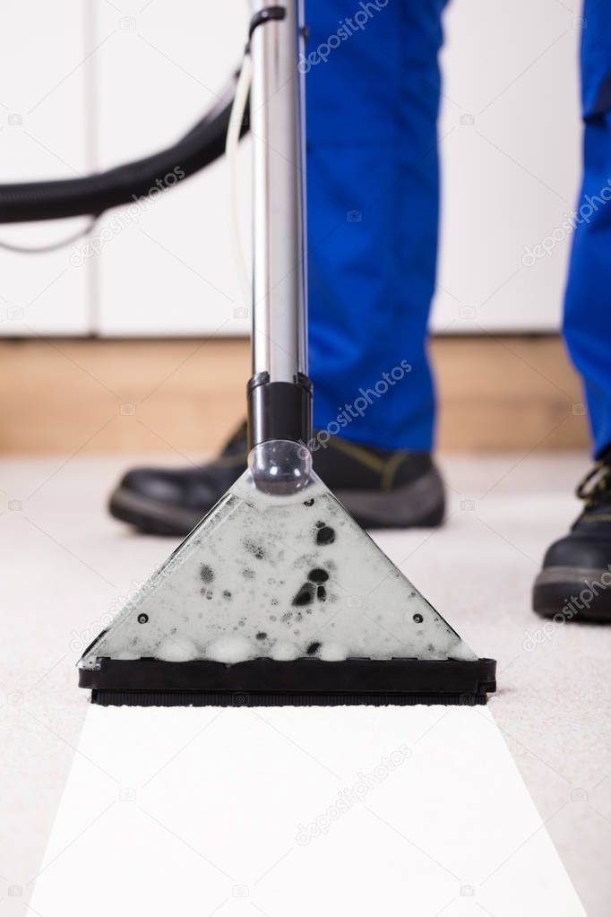 Person Using Vacuum Cleaner 