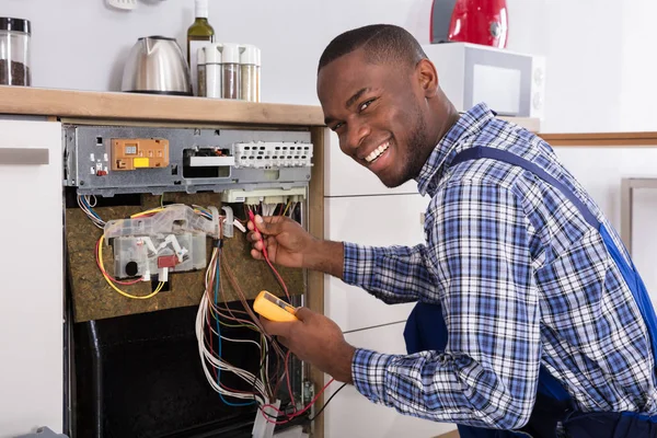 Technician Fixing Dishwasher — Stock Photo, Image