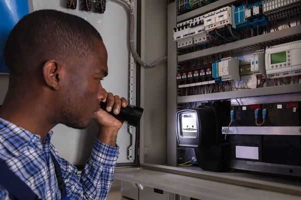 Technician Holding Flashlight — Stock Photo, Image