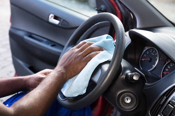 Worker Cleaning Car Steering Wheel — Stock Photo, Image