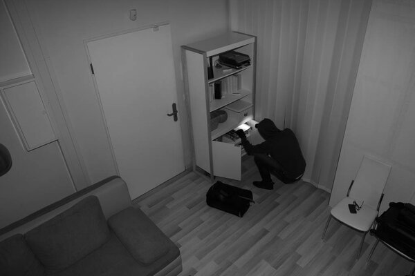 Robber Searching House For Valuables
