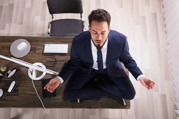 Businessman Doing Yoga In Office — Stock Photo, Image