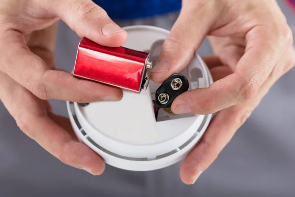 Person's Hand Inserting Battery — Stock Photo, Image