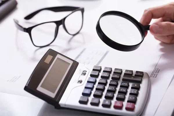 Businessman Hand Examining Invoice — Stock Photo, Image