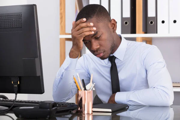 Businessman Sitting With Head In Hand — Stock Photo, Image